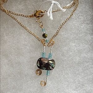 Elegant Gold Necklace with Black Pendant